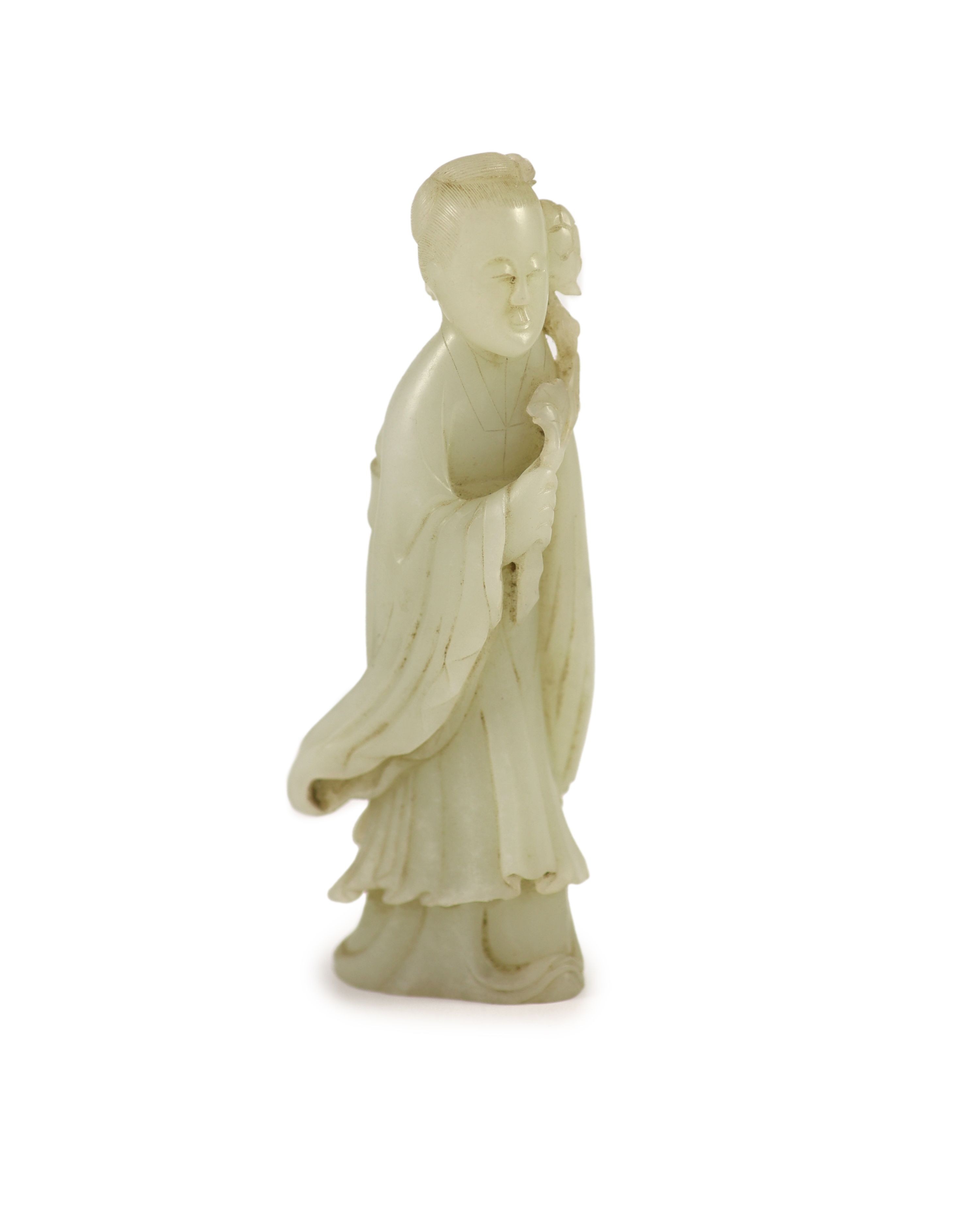A Chinese pale celadon jade figure of a lady, 18th century